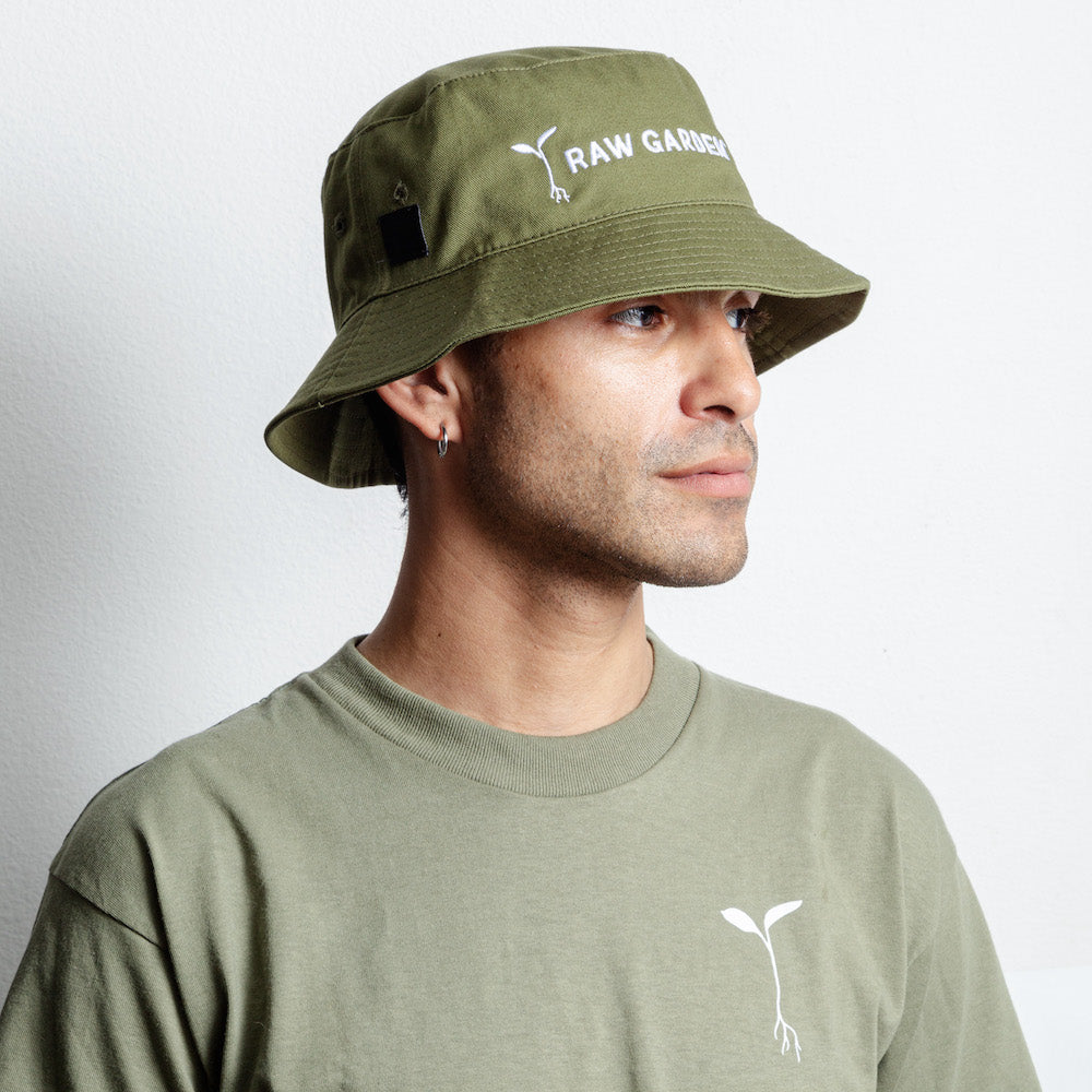 Man wearing Raw Garden bucket hat with green sprout tee shirt