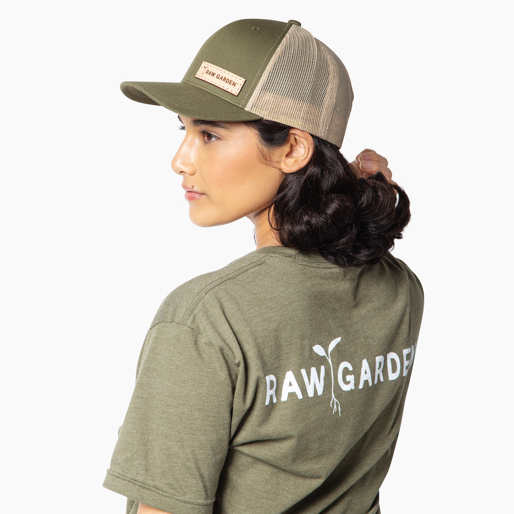 Wearing snapback hat with green Raw Garden shirt